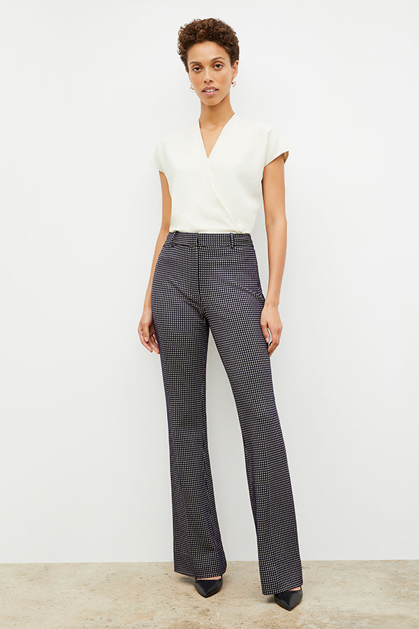 Front image of a woman wearing the horton pant in black and white houndstooth | Exclude