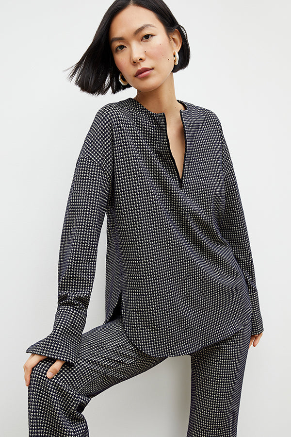 Front image of a woman wearing the horton pant in black and white houndstooth | Exclude