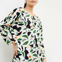 Front image of woman wearing the alesia dress in icon print