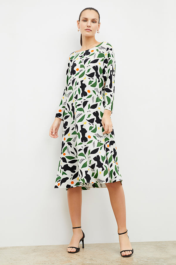 Front image of a woman wearing the alesia dress in icon print | Exclude