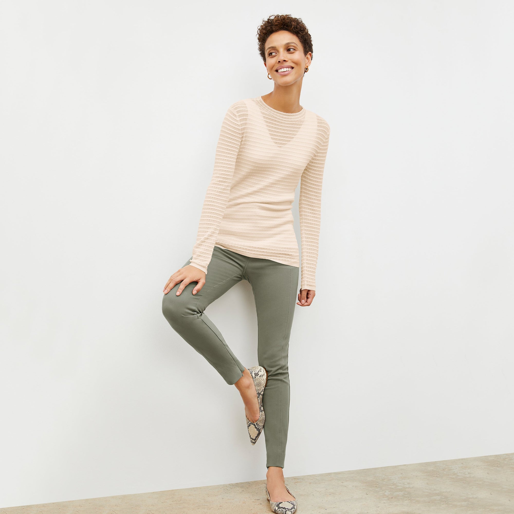Front image of a woman wearing the skinny foster in thyme | Lead