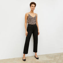 Front image of a woman standing wearing the Lisey Cami—Sahara Print Washable Silk in Tan/Black