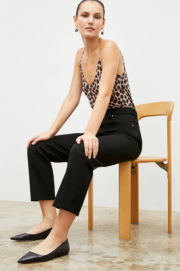 Front image of a woman sitting wearing the Lisey Cami—Sahara Print Washable Silk in Tan/Black | Exclude