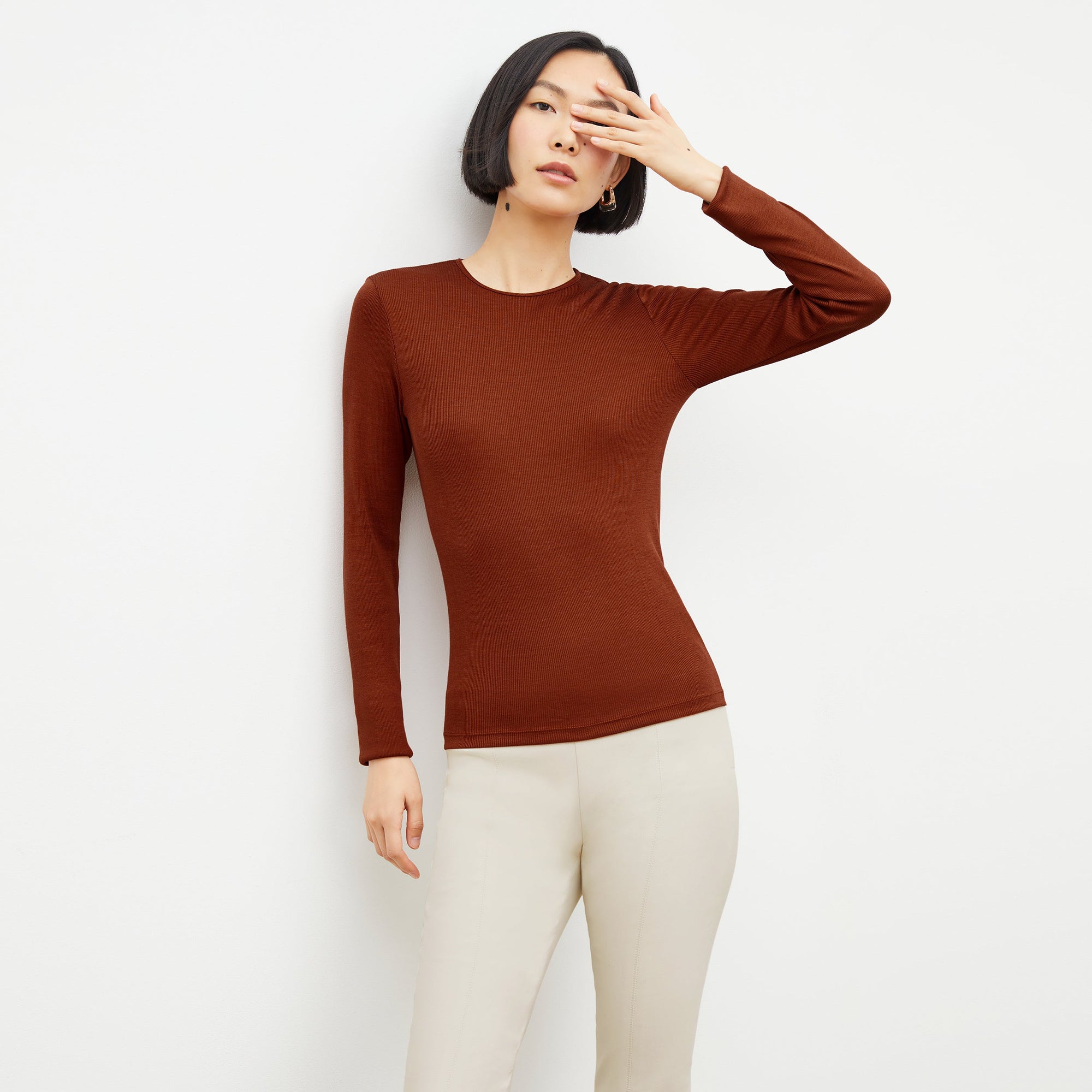 Front image of a woman standing wearing the foster pant in bone