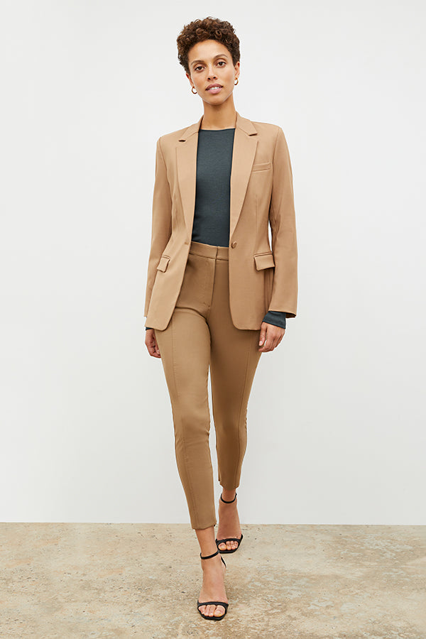 Front image of a woman standing wearing the Yiyan Blazer in Camel | Exclude
