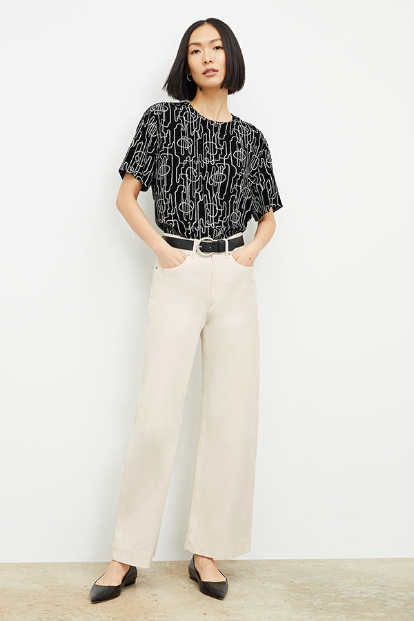 Front image of a woman wearing the Milo Jean in Tusk | Exclude