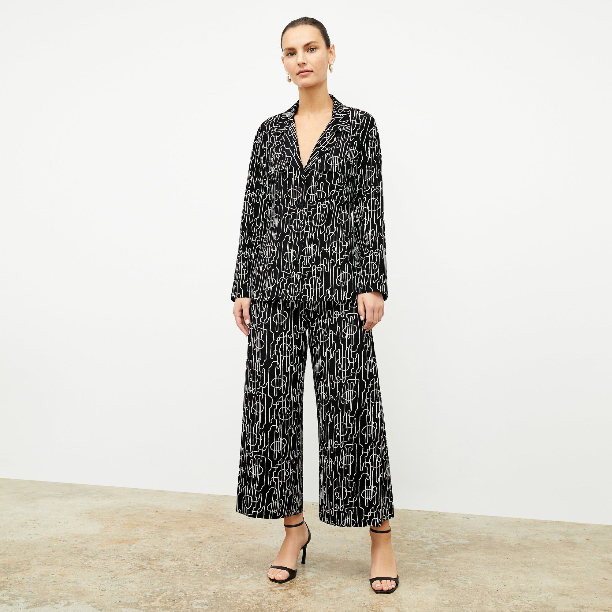 front image of a woman wearing the alyssa jacket in symphony print