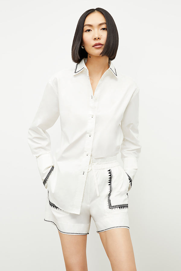 front image of a woman wearing the adina short in white | Exclude | Grid