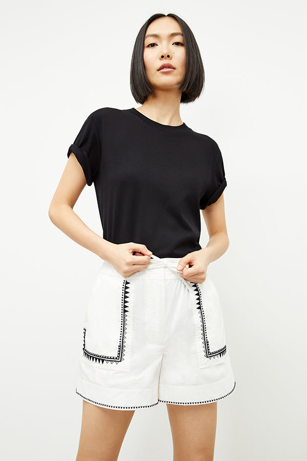 front image of a woman wearing the adina short in white | Exclude | Grid