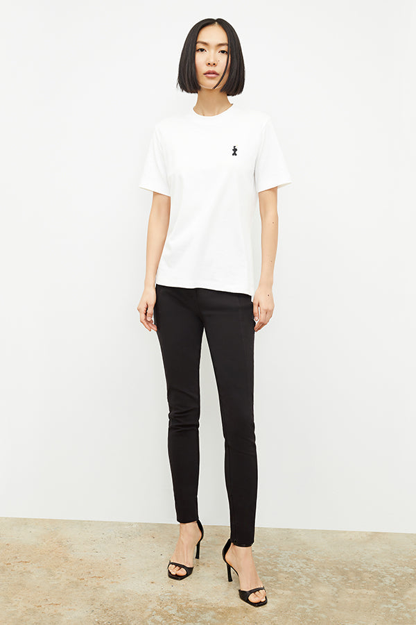 Front image of a woman standing wearing the curie pant in black | Grid Hover | Exclude
