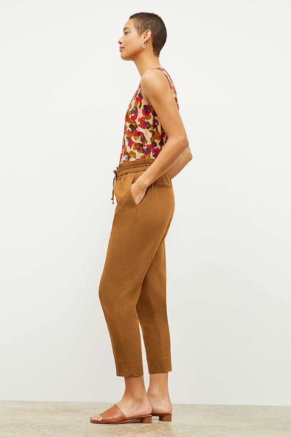 Side image of a woman wearing the Shane Pant in Acorn | Exclude 