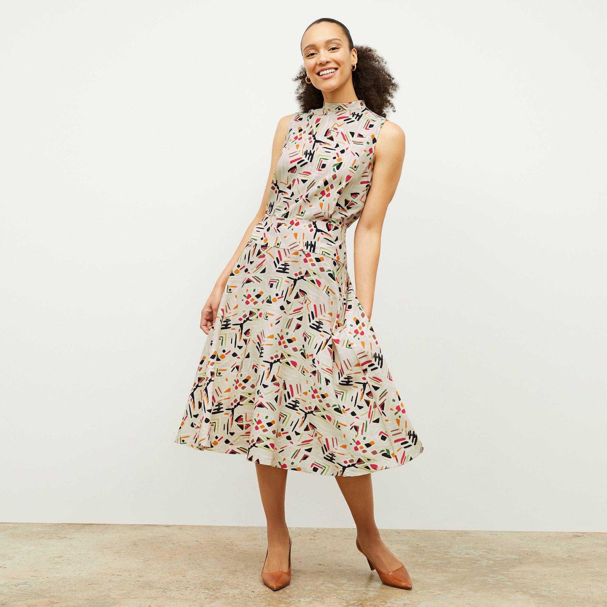 front image of a woman wearing the oona dress in rhythm print | Lead