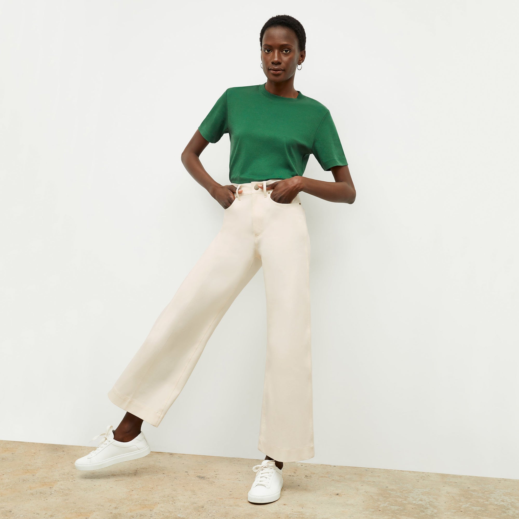 Front image of a woman standing wearing the milo jean in tusk | Exclude