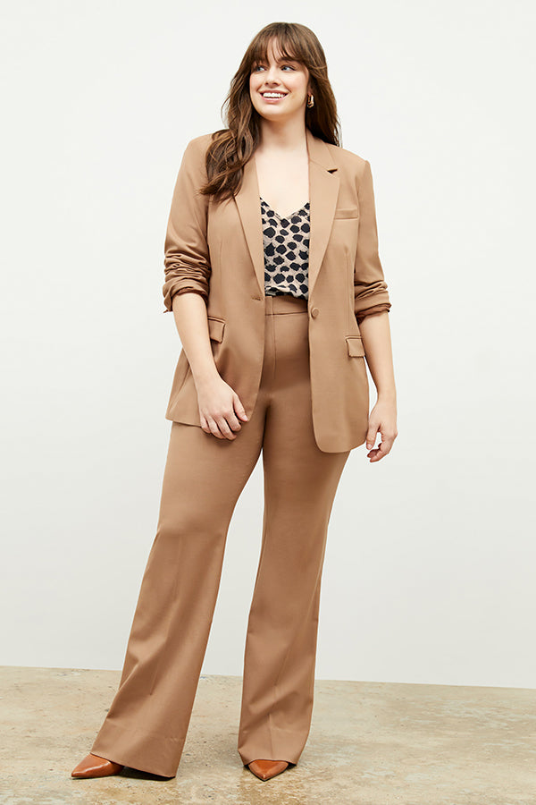 Front image of a woman standing wearing the Lisey Cami—Sahara Print Washable Silk in Tan/Black | Exclude
