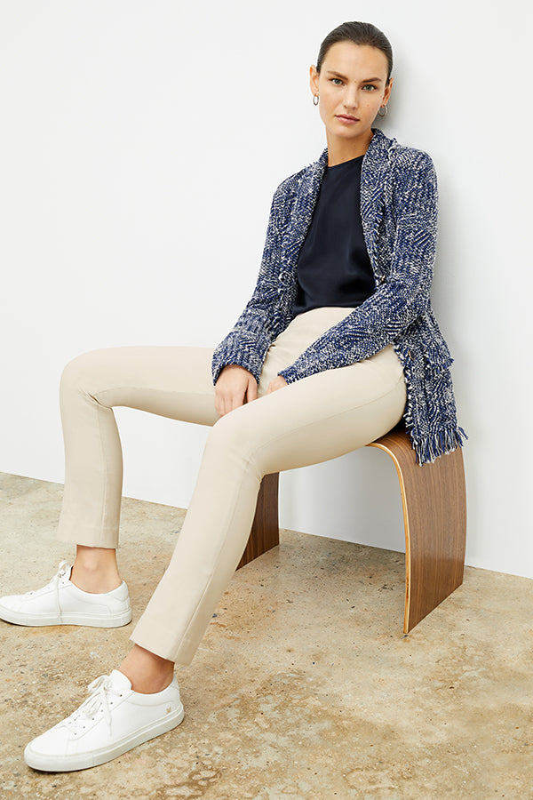 Front image of a woman standing wearing the foster pant in bone | Exclude