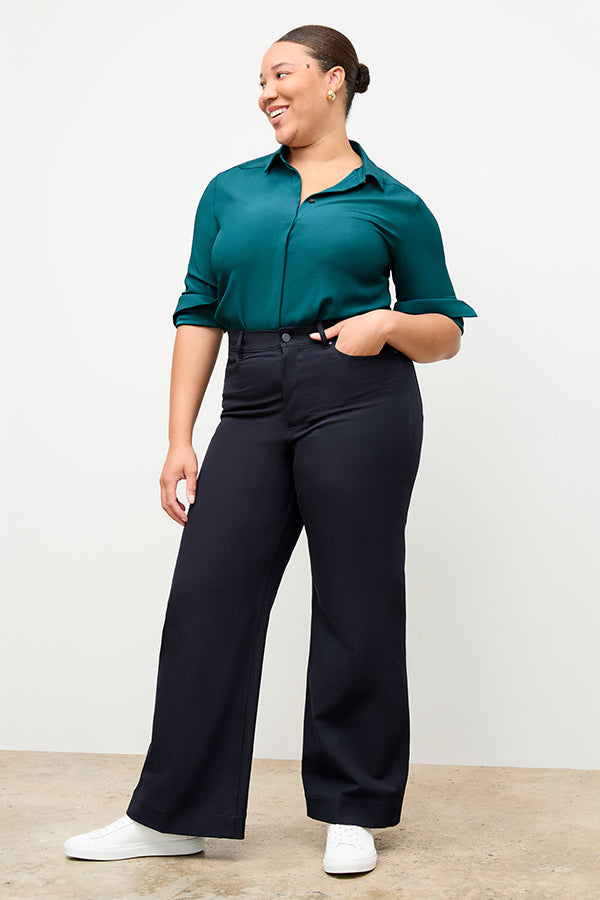 Front image of a woman standing wearing the Milo Jean in ink | Exclude