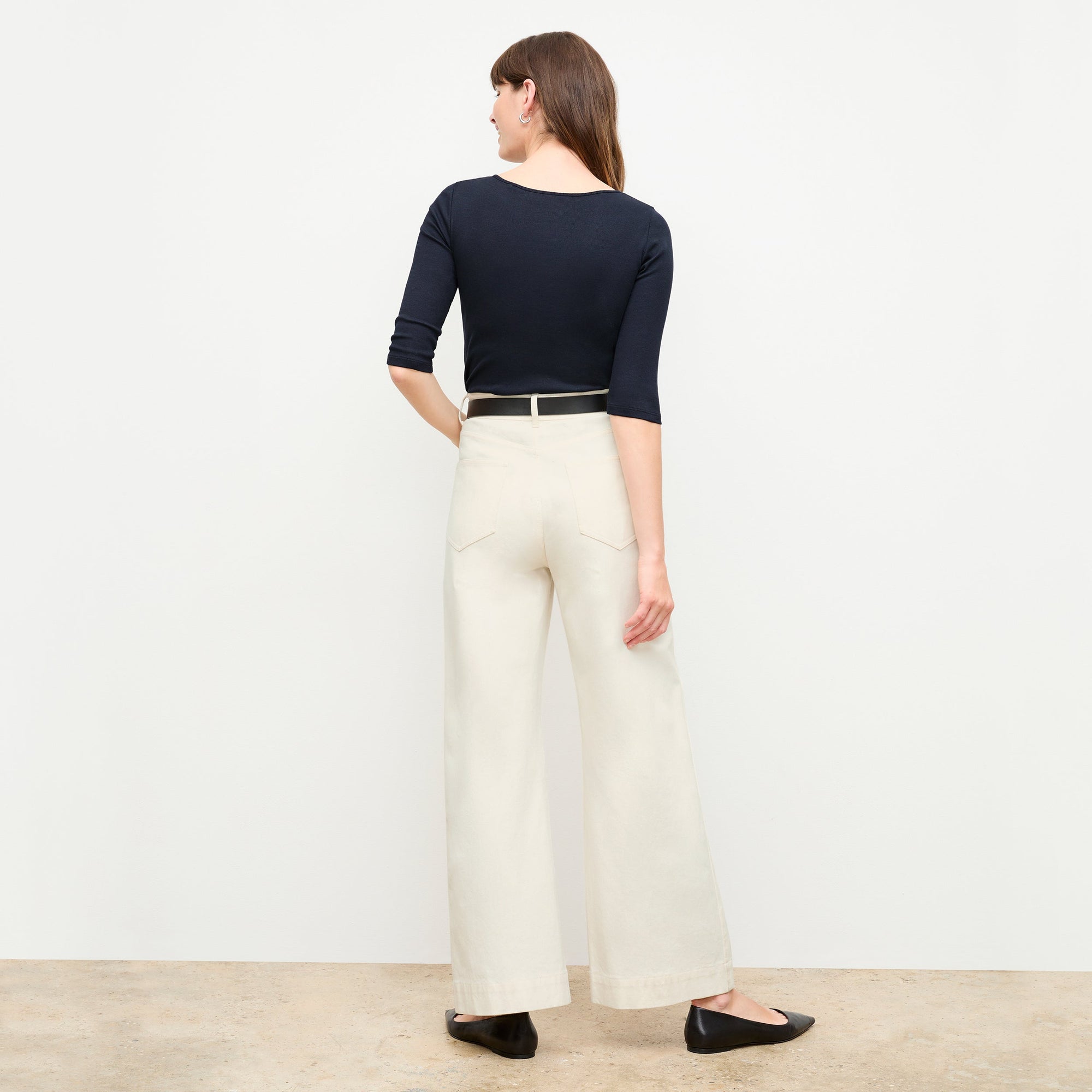 back image of a woman wearing the Milo Jean in Tusk | Exclude