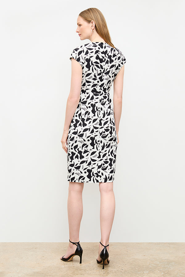 back image of a woman wearing the masha dress in icon print | Exclude