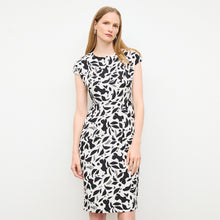 front image of a woman wearing the masha dress in icon print | Lead