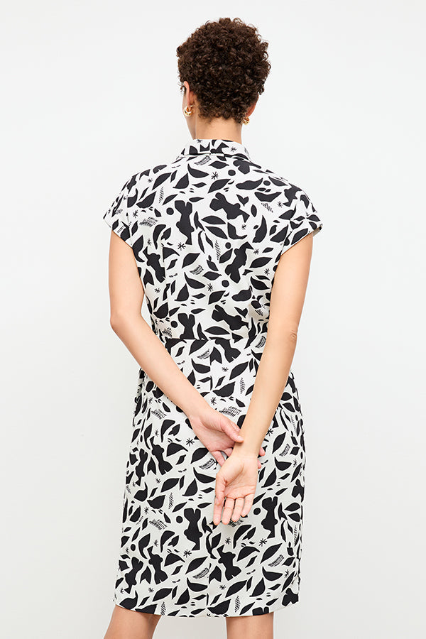 back image of a woman wearing the tory dress in icon print | Exclude