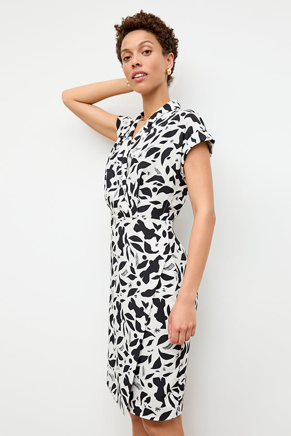 front image of a woman wearing the tory dress in icon print | Exclude