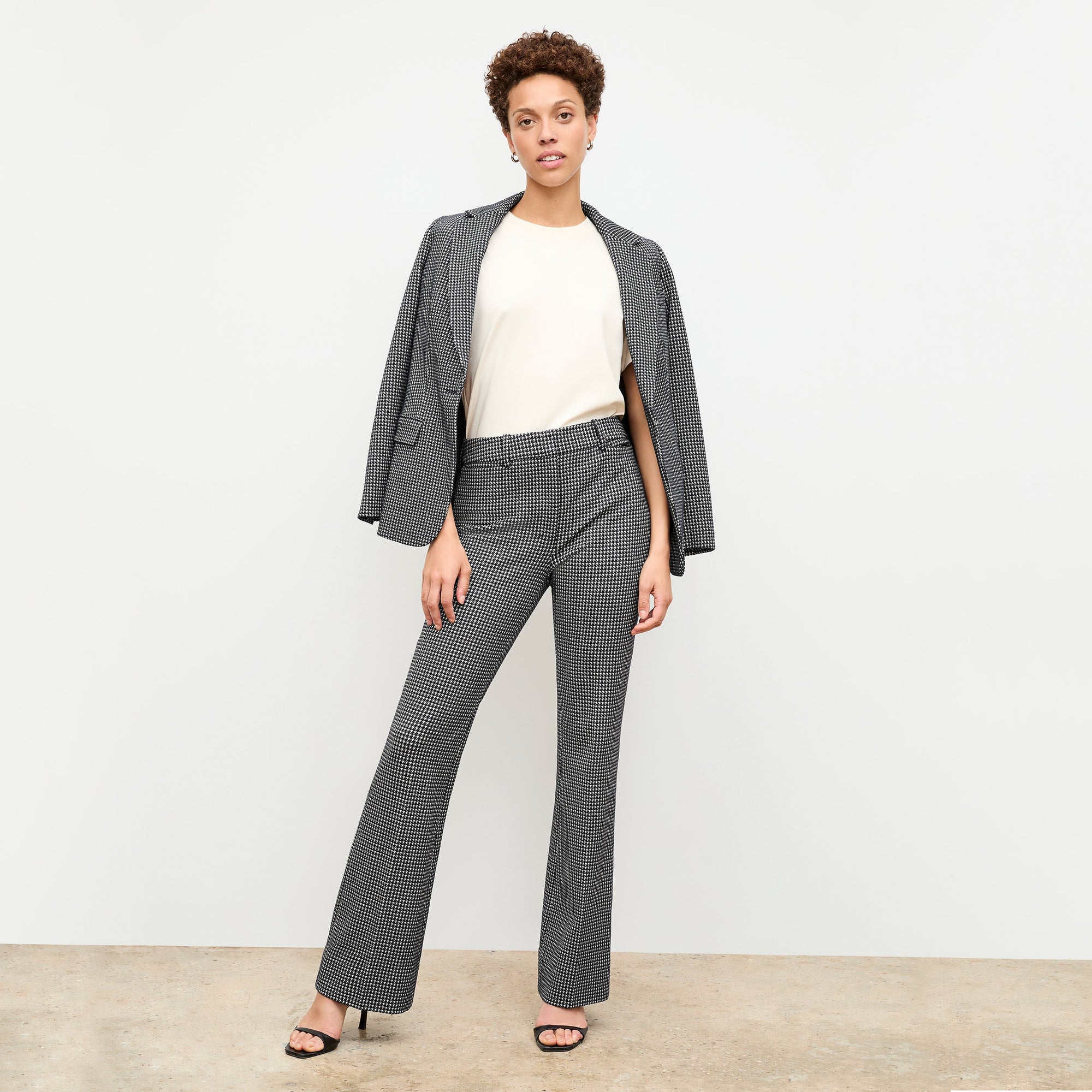 front image of a woman wearing the yiyan jacket in stretch houndstooth