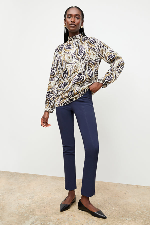 Front image of a woman standing wearing the foster pant in dark navy | Exclude | Grid