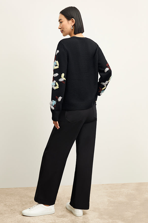 back image of a woman wearing the Milo Jean in Black | Exclude