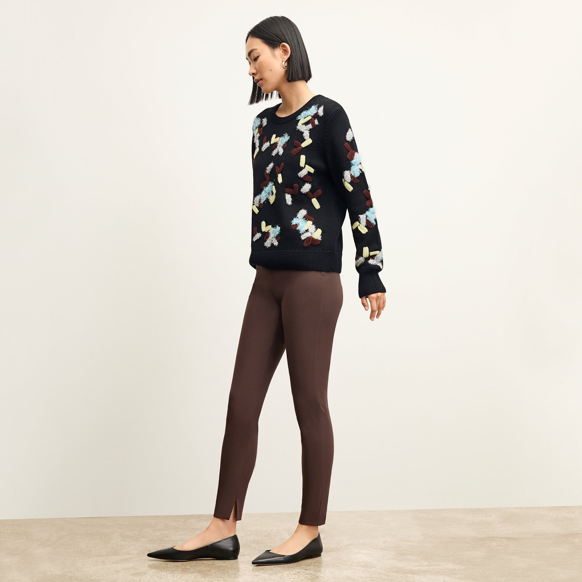 side image of a woman wearing the skinny foster pants in Mahogany
