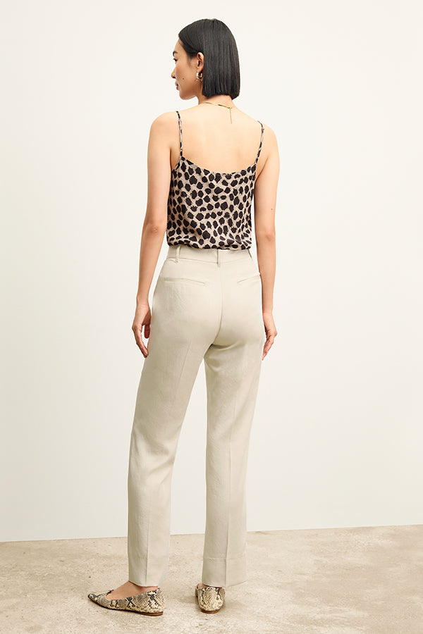 Front image of a woman standing wearing the Lisey Cami—Sahara Print Washable Silk in Tan/Black | Exclude