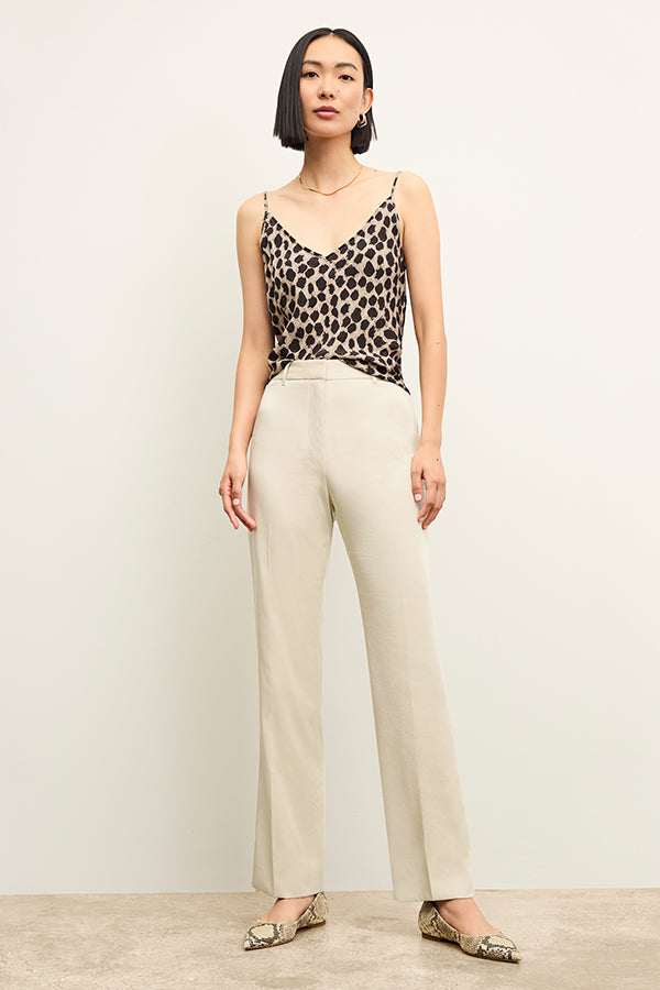 Front image of a woman standing wearing the Lisey Cami—Sahara Print Washable Silk in Tan/Black | Exclude