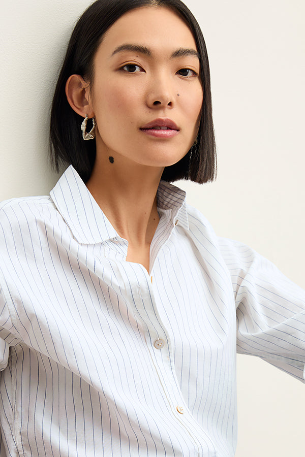 Front image of a woman wearing the Mila Button Down - Poplin Stripe in Blue / Ivory | Grid Hover