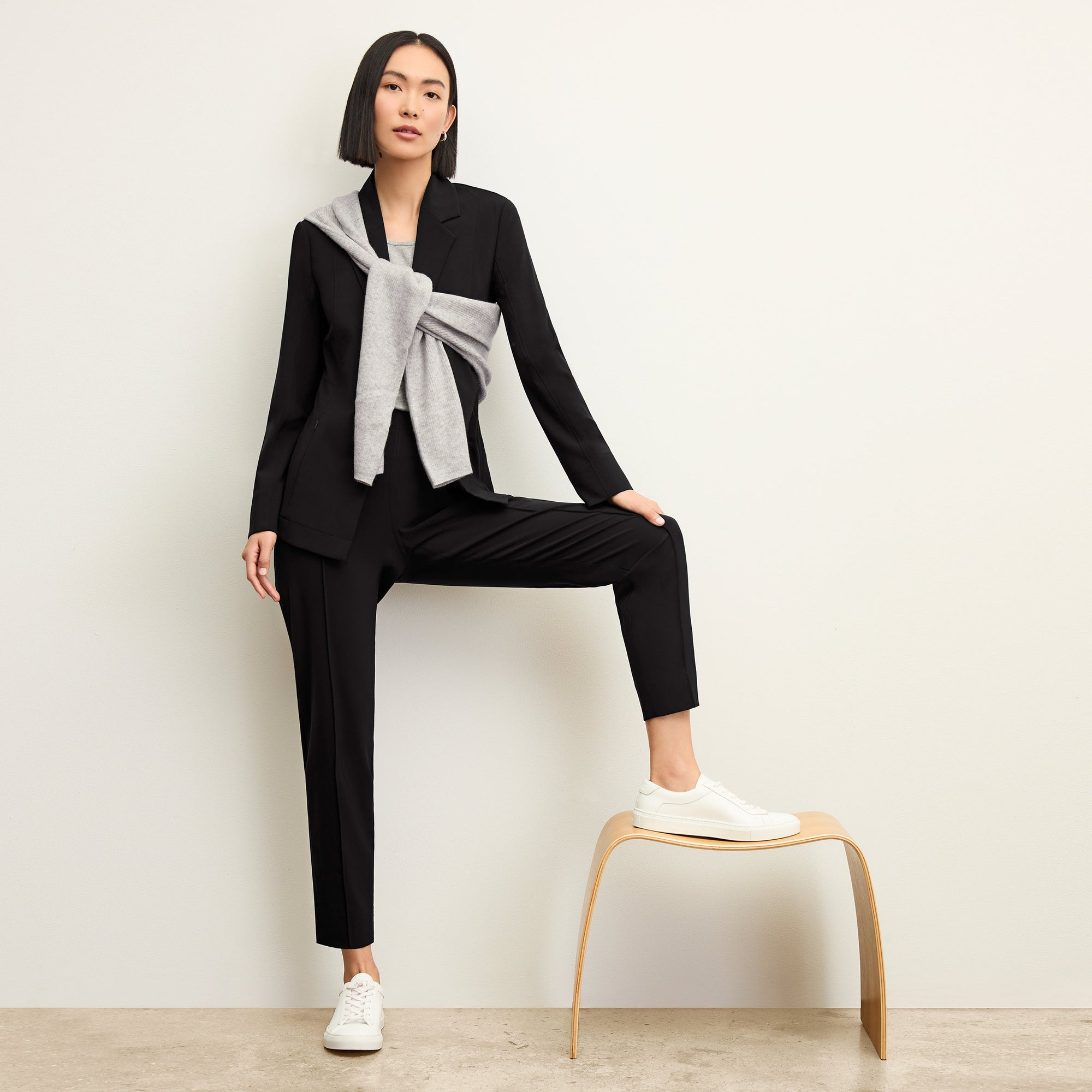 Front image of a woman standing wearing the Colby Jogger in Black | Exclude