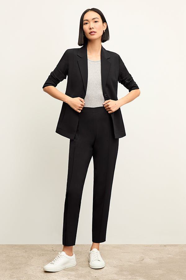 Front image of a woman standing wearing the Colby Jogger in Black | Exclude | Grid