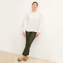 front image of woman wearing foster pant in dark olive | Exclude