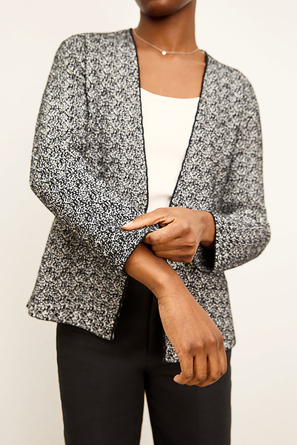 front image of a woman wearing the woolf jardigan in black/ivory | Exclude | Grid Hover