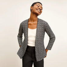front image of a woman wearing the woolf jardigan in black/ivory | Lead