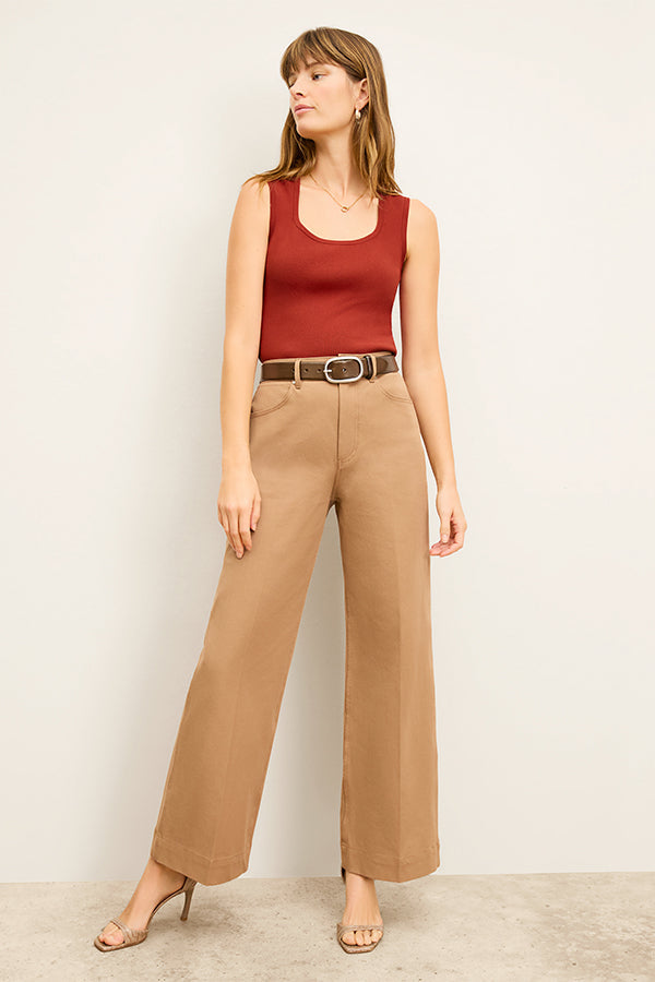 front image of a woman wearing the milo jean in saddle | Exclude