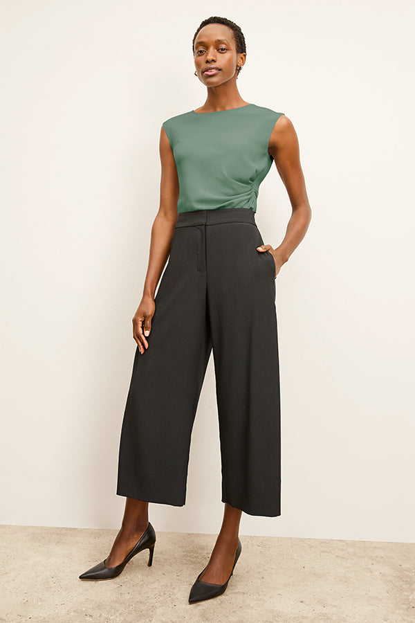 Front image of a woman standing wearing the Zhou culotte in black | Exclude