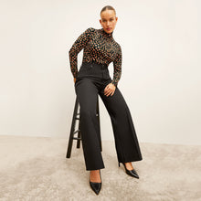 Front image of a woman wearing the Milo Jean in Black