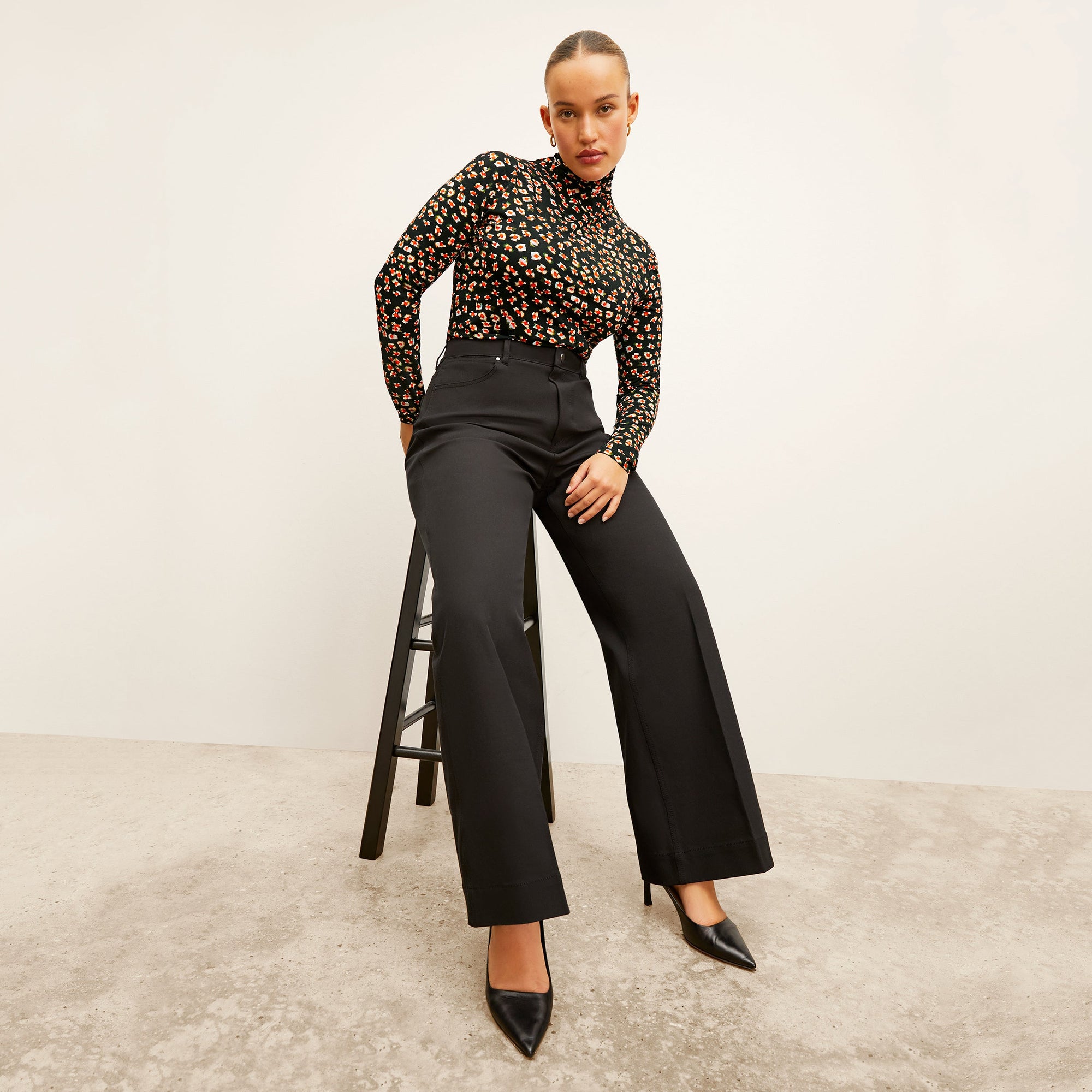 Front image of a woman wearing the Milo Jean in Black
