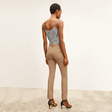 back image of a woman wearing the roma jean in saddle