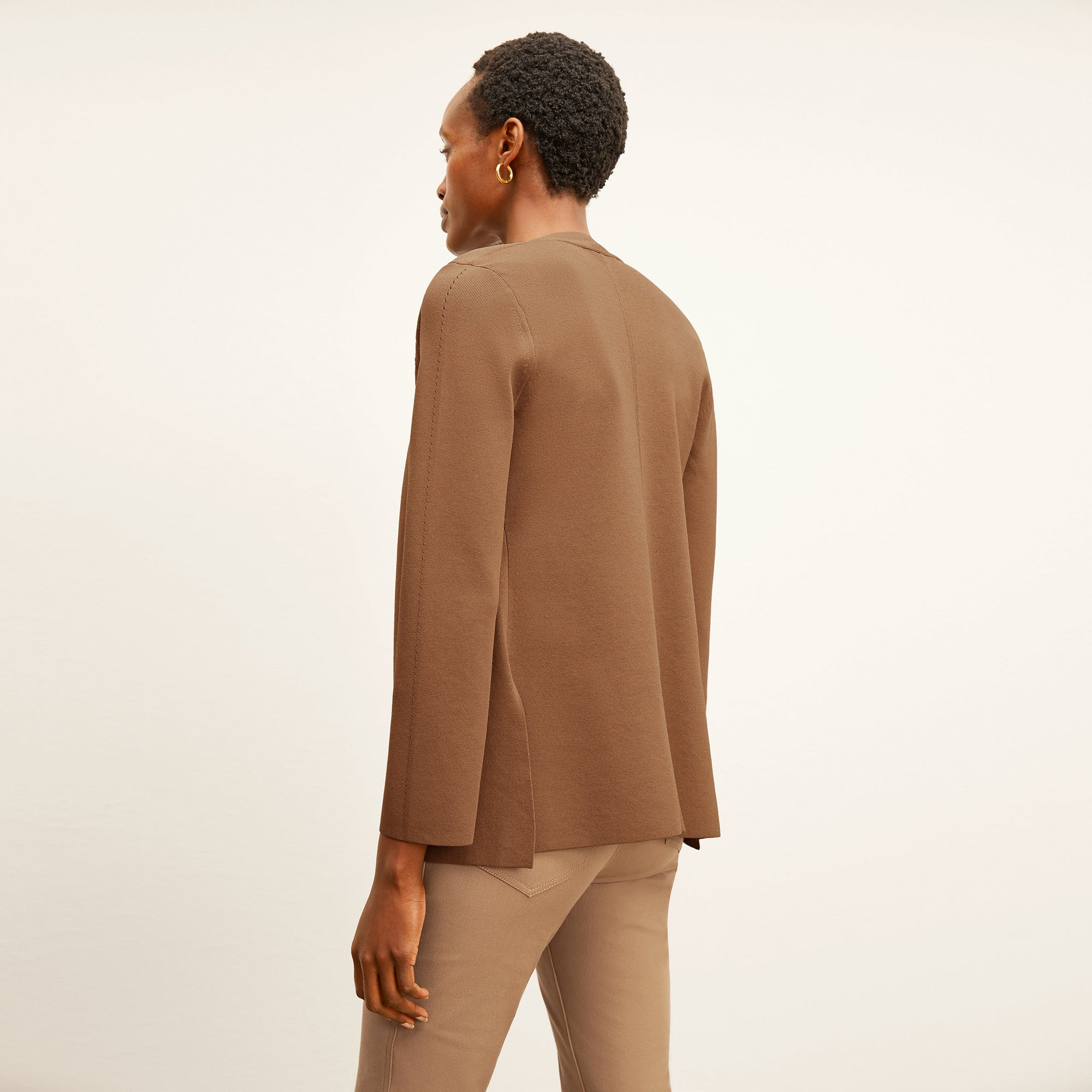  back image of a woman wearing the roma jean in saddle | Exclude