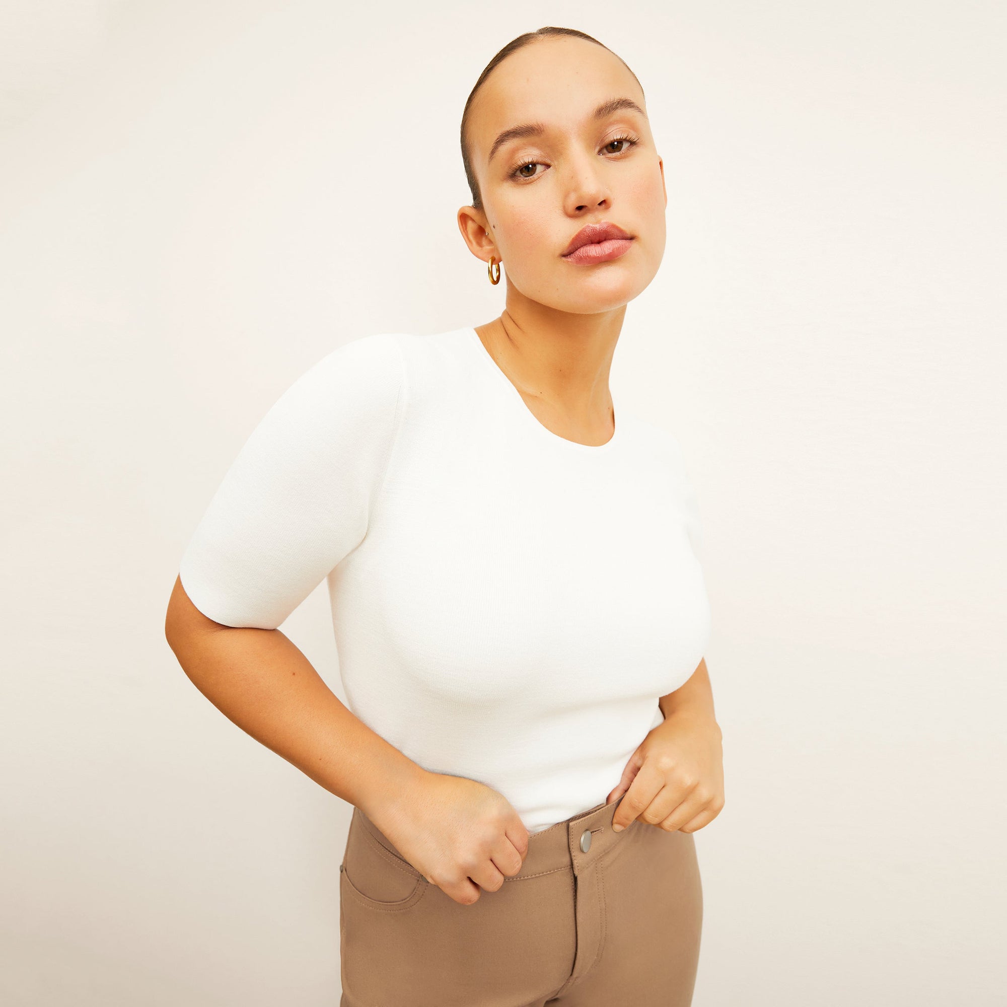 front image of a woman wearing the roma jean in saddle | Exclude