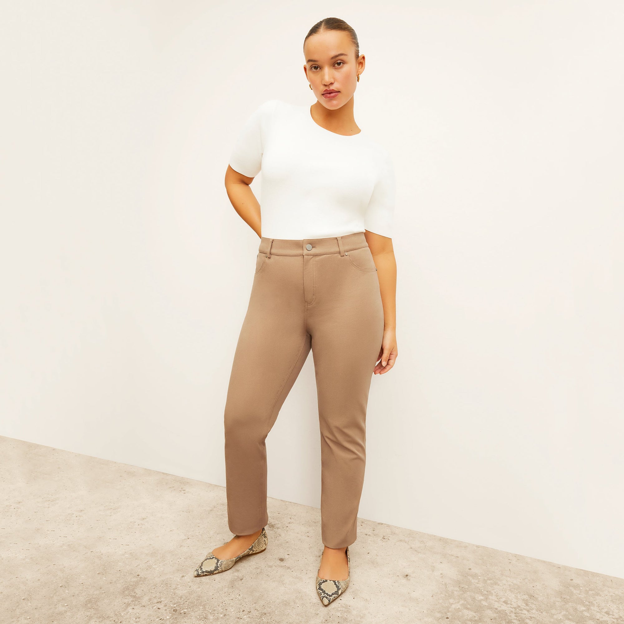 front image of a woman wearing the roma jean in saddle