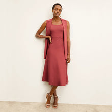 front image of a woman wearing the anh jardigan in carnation