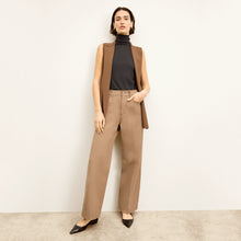 front image of a woman wearing the milo jean in saddle | Lead