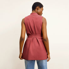 back image of a woman wearing the anh jardigan in carnation