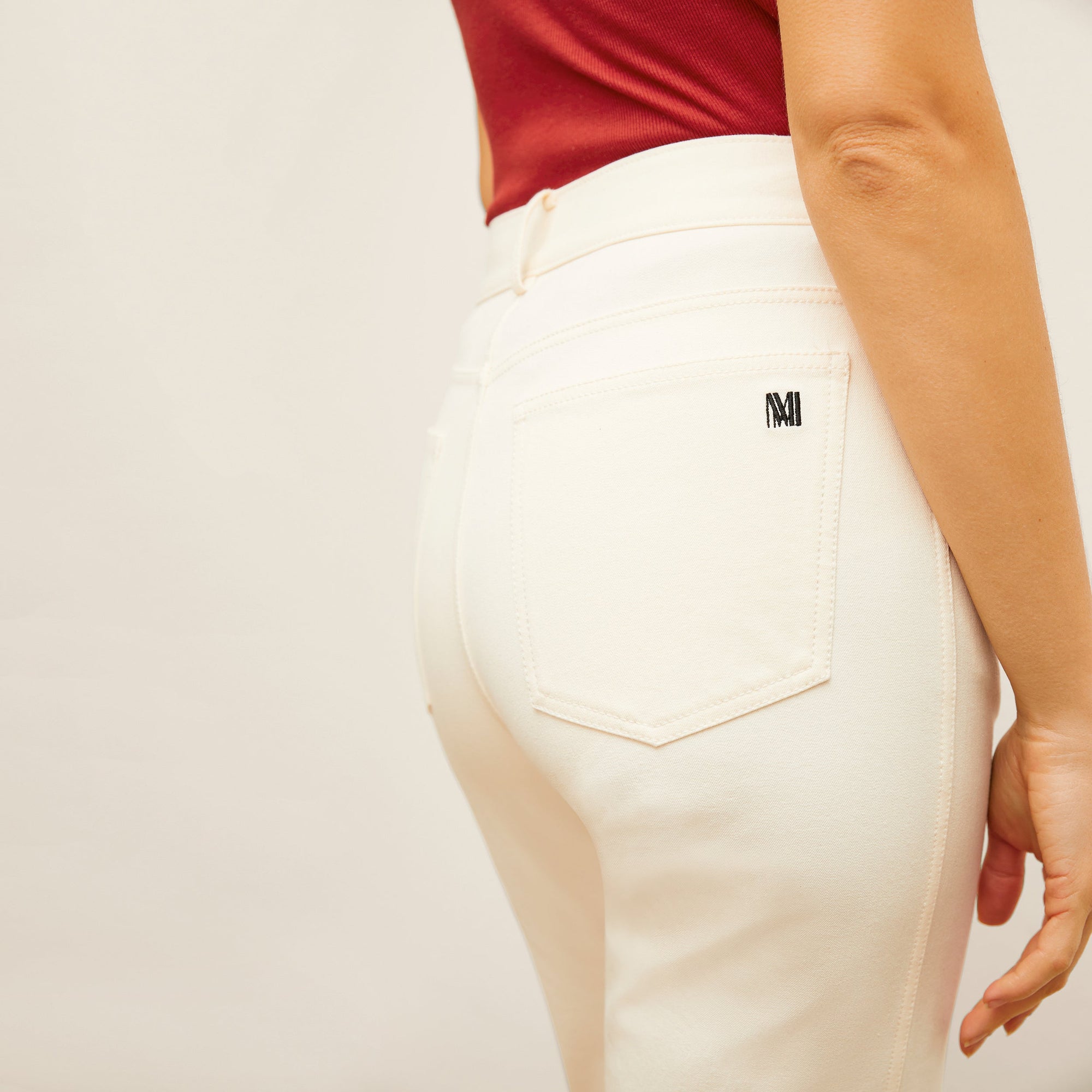 detail image of the M.M. LaFleur logo on the pocket of the daria jean in tusk  | Exclude