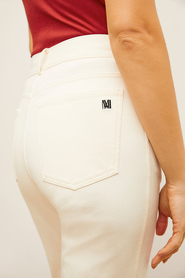 detail image of the M.M. LaFleur logo on the pocket of the daria jean in tusk | Exclude